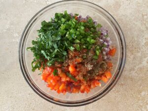 Unmixed bowl of salsa ingredients 