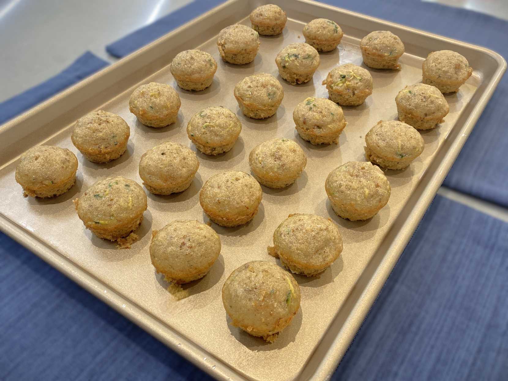 Zucchini Bread Mini Muffins on baking sheet